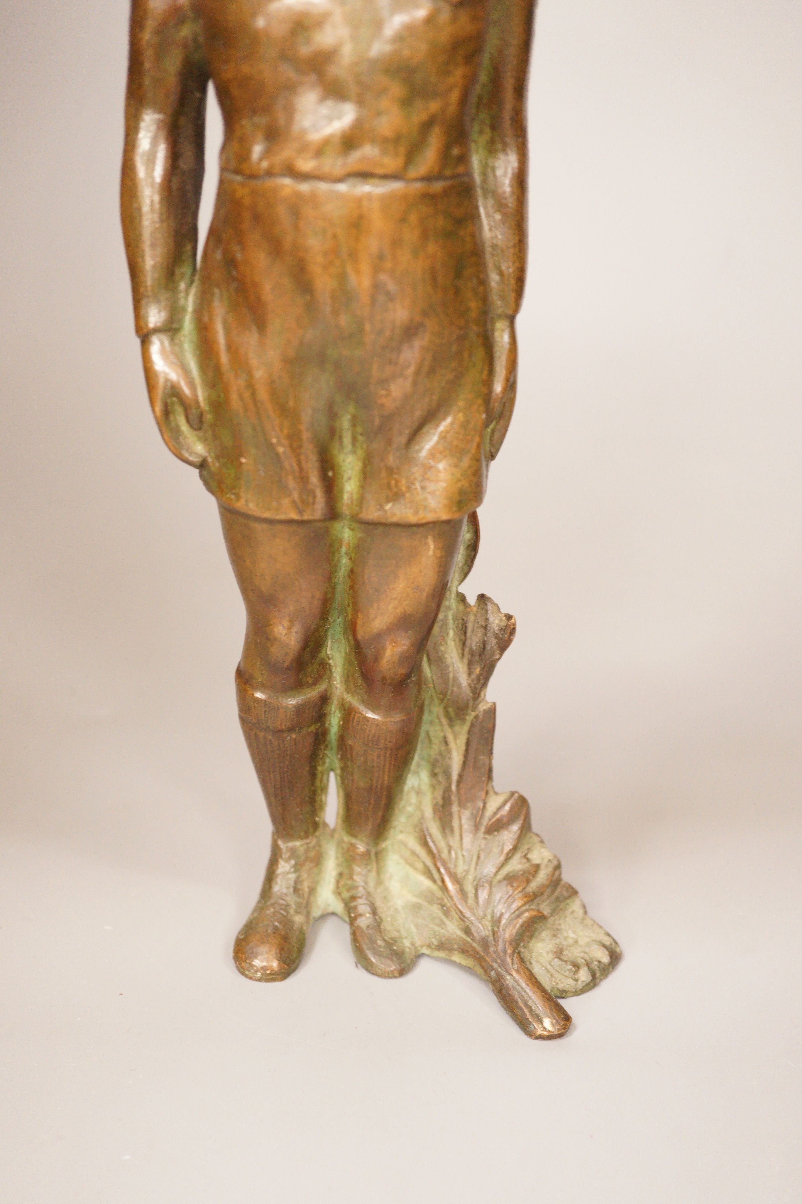 An early 20th century bronze figural element, standing figure, ex sporting presentation, 30cm